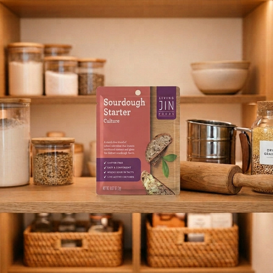 A perfectly organized, modern kitchen pantry showing a sleek, shelf-stable package of Livingjin Easy Sourdough Starter next to clean baking tools.