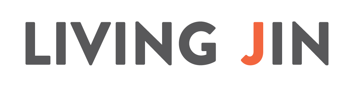 The official logo for LIVING JIN, featuring bold, sans-serif typography. The word "LIVING" and the letters "IN" are in dark grey, while the letter "J" is highlighted in a vibrant orange, set against a transparent checkered background.